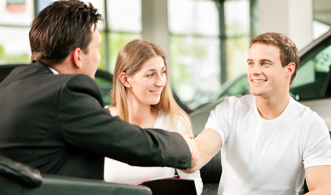 Financing your Chevy vehicle Couple buying a new car