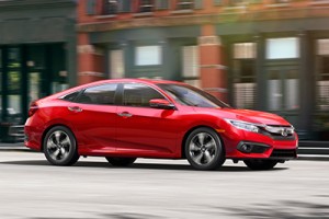 16_Civic_Sedan_Touring_Location_CityDriving_RalleyeRed